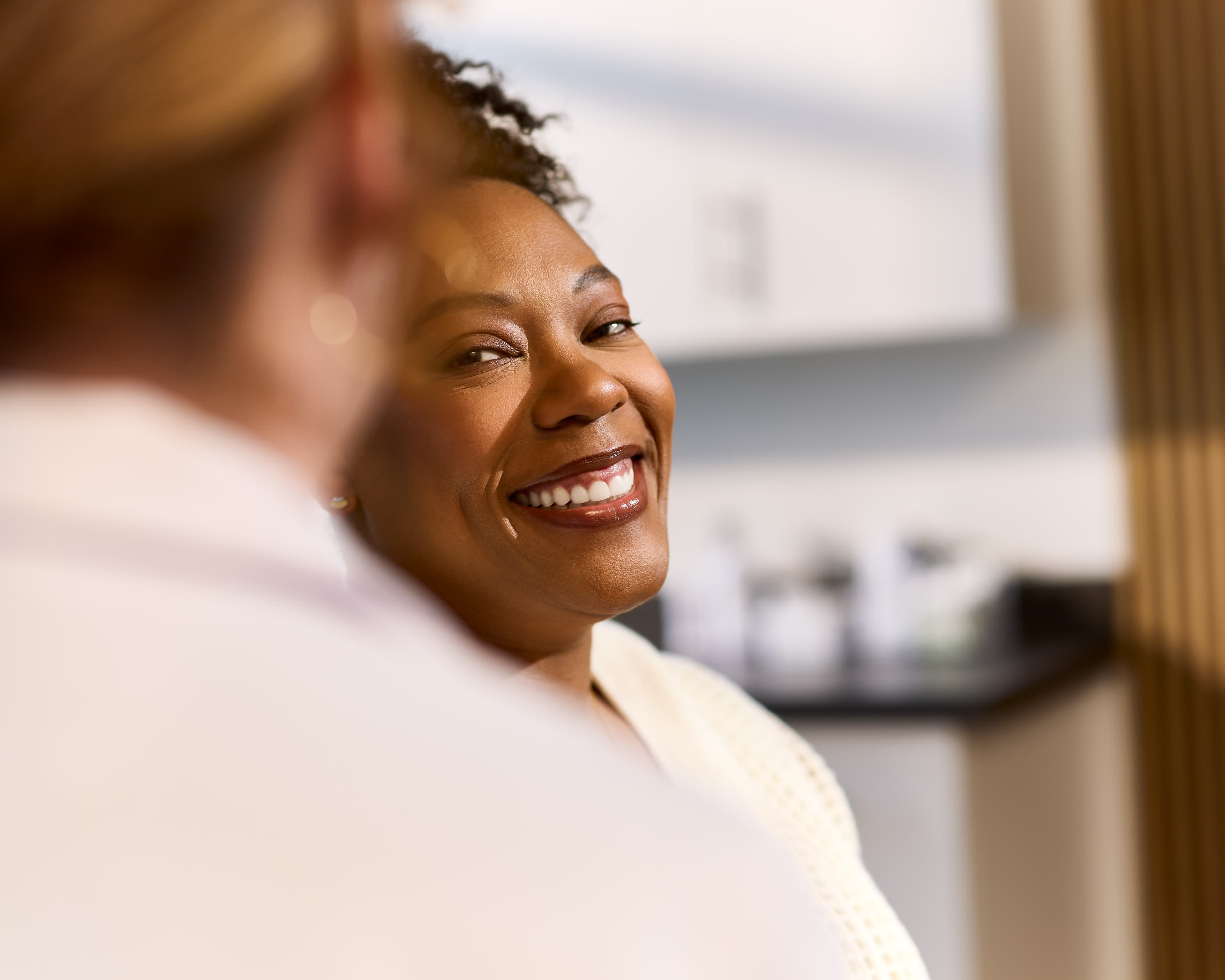 Smiling Patient in Exam Room