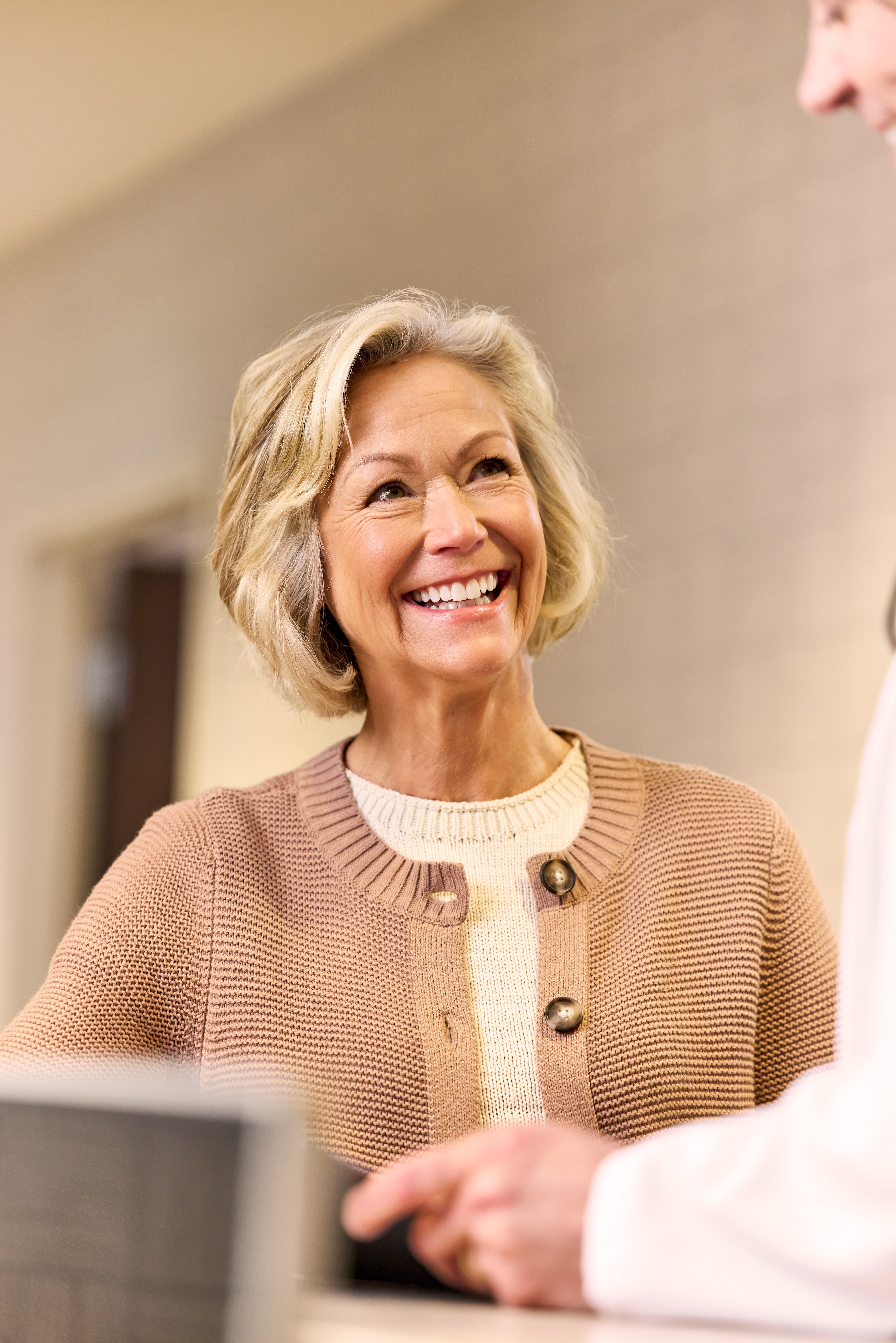 20-join-us-practices-stay-local-smiling-patient-2026 03 Qualderm BR Hallway 1281