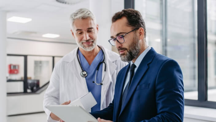 dermatologist talking to business man